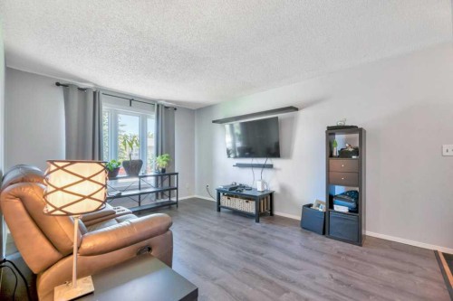 23 Abbercove Road Se, Calgary, AB - Indoor Photo Showing Living Room