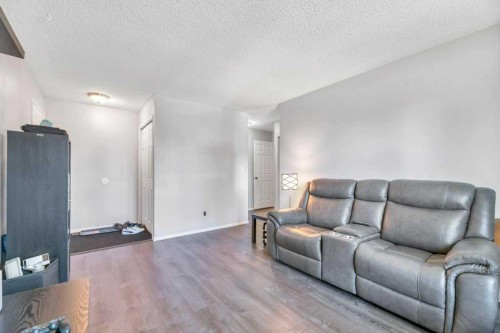 23 Abbercove Road Se, Calgary, AB - Indoor Photo Showing Living Room