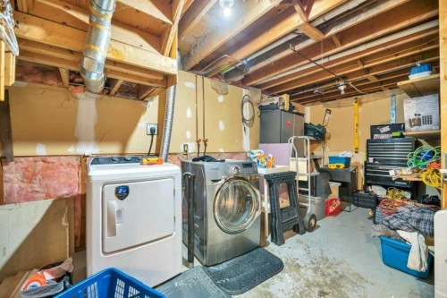 23 Abbercove Road Se, Calgary, AB - Indoor Photo Showing Laundry Room