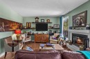 246 Kluane Drive, Banff, AB  - Indoor Photo Showing Living Room With Fireplace 
