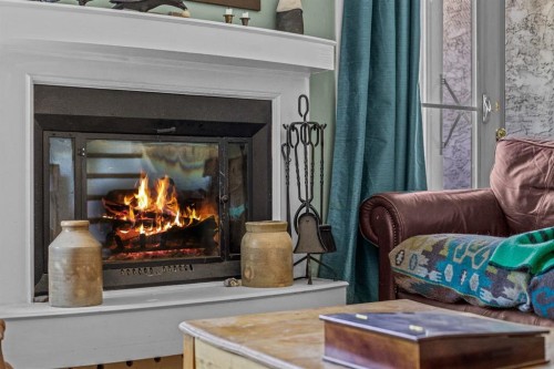 246 Kluane Drive, Banff, AB - Indoor With Fireplace