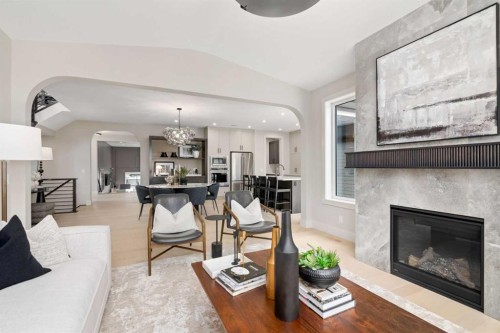 364 Greenwich Drive Nw, Calgary, AB - Indoor Photo Showing Living Room With Fireplace
