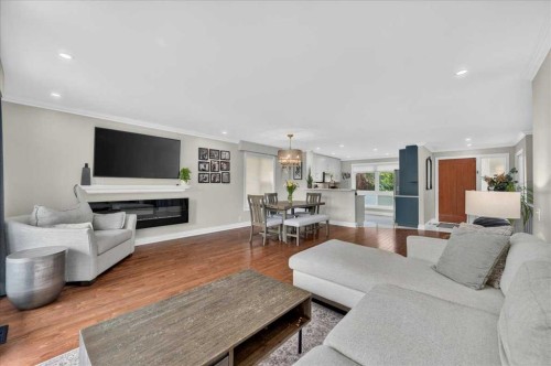 756 Strathcona Drive Sw, Calgary, AB - Indoor Photo Showing Living Room With Fireplace