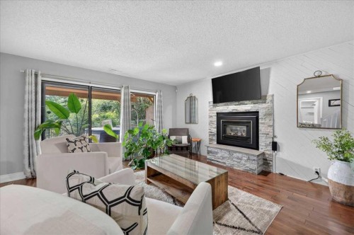 756 Strathcona Drive Sw, Calgary, AB - Indoor Photo Showing Living Room With Fireplace