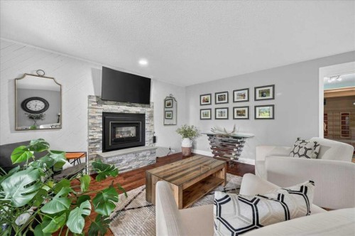 756 Strathcona Drive Sw, Calgary, AB - Indoor Photo Showing Living Room With Fireplace