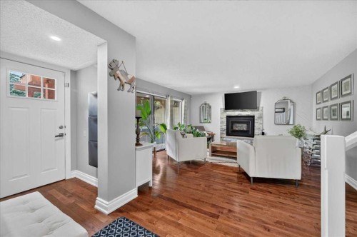 756 Strathcona Drive Sw, Calgary, AB - Indoor Photo Showing Living Room With Fireplace
