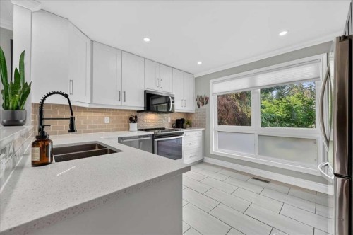756 Strathcona Drive Sw, Calgary, AB - Indoor Photo Showing Kitchen With Double Sink With Upgraded Kitchen