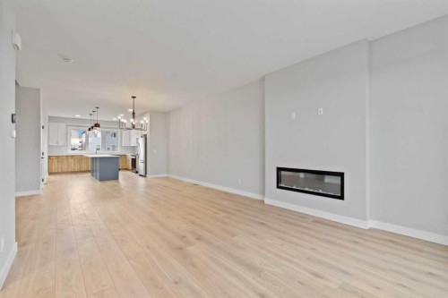 343 Belvedere Drive Se, Calgary, AB - Indoor Photo Showing Living Room With Fireplace