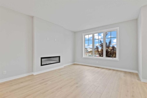 343 Belvedere Drive Se, Calgary, AB - Indoor Photo Showing Living Room With Fireplace