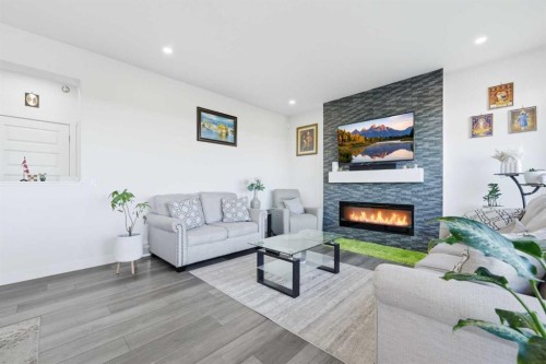 109 Homestead Crescent Ne, Calgary, AB - Indoor Photo Showing Living Room With Fireplace