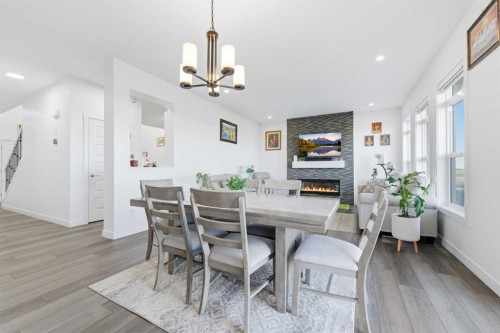 109 Homestead Crescent Ne, Calgary, AB - Indoor Photo Showing Dining Room With Fireplace