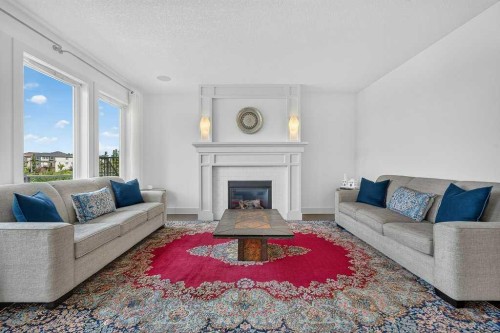 232 Copperpond Circle Se, Calgary, AB - Indoor Photo Showing Living Room With Fireplace