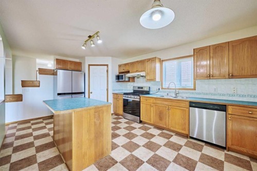 9683 Hidden Valley Drive Nw, Calgary, AB - Indoor Photo Showing Kitchen With Double Sink