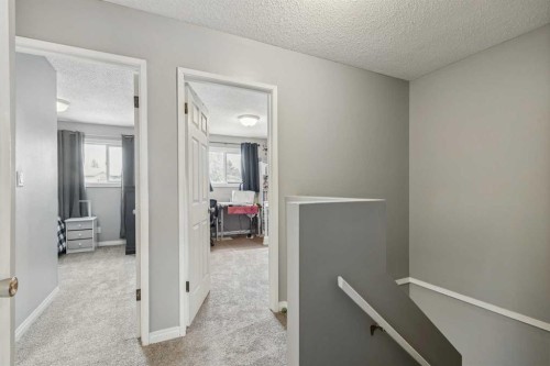 113-107 Elm Place, Okotoks, AB - Indoor Photo Showing Other Room