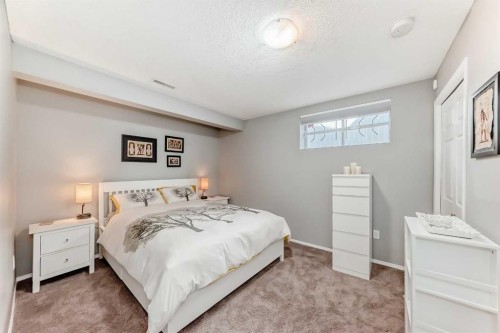 78 Arbour Butte Road Nw, Calgary, AB - Indoor Photo Showing Bedroom