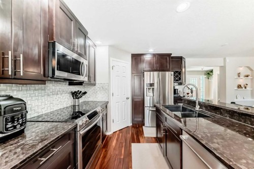 78 Arbour Butte Road Nw, Calgary, AB - Indoor Photo Showing Kitchen With Double Sink With Upgraded Kitchen