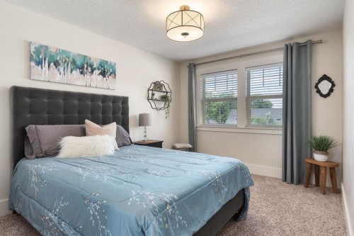 313 Centre Avenue Se, Airdrie, AB - Indoor Photo Showing Bedroom