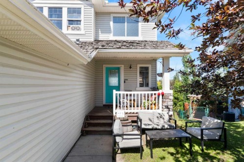 151 Bow Ridge Crescent, Cochrane, AB - Outdoor With Deck Patio Veranda