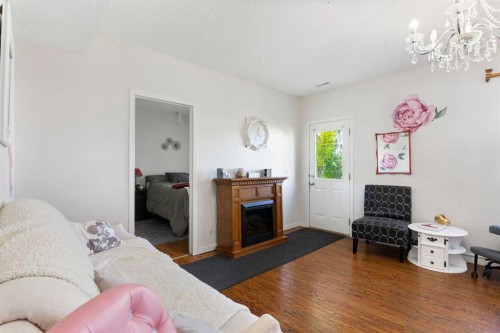 151 Bow Ridge Crescent, Cochrane, AB - Indoor Photo Showing Living Room With Fireplace