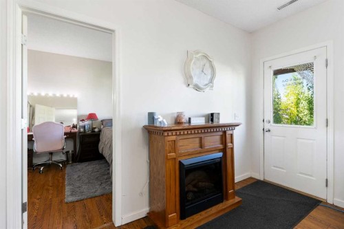 151 Bow Ridge Crescent, Cochrane, AB - Indoor With Fireplace
