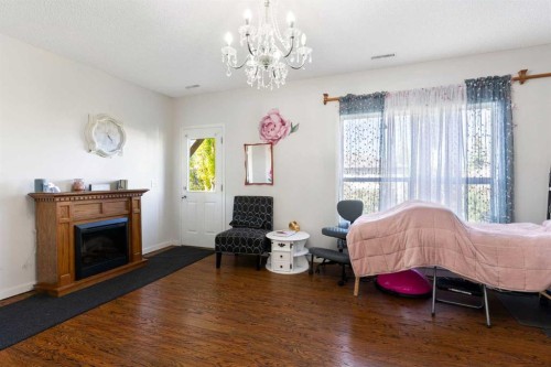 151 Bow Ridge Crescent, Cochrane, AB - Indoor Photo Showing Living Room With Fireplace