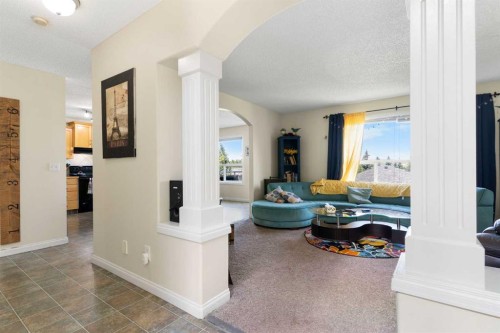 151 Bow Ridge Crescent, Cochrane, AB - Indoor Photo Showing Living Room