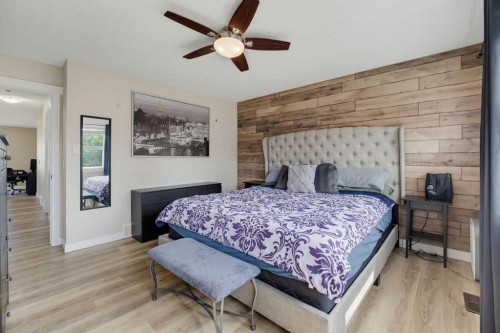 145 Sunset Manor, Cochrane, AB - Indoor Photo Showing Bedroom