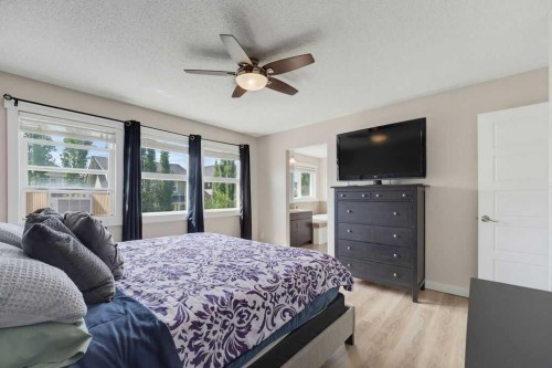 145 Sunset Manor, Cochrane, AB - Indoor Photo Showing Bedroom