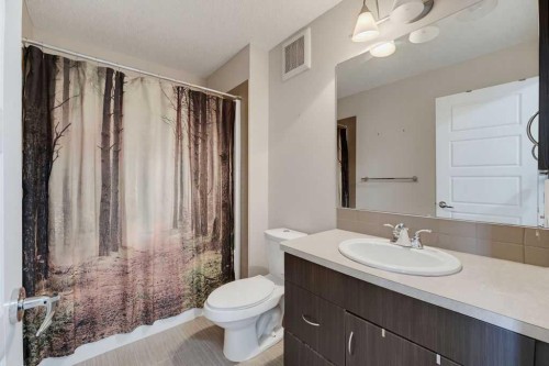 145 Sunset Manor, Cochrane, AB - Indoor Photo Showing Bathroom