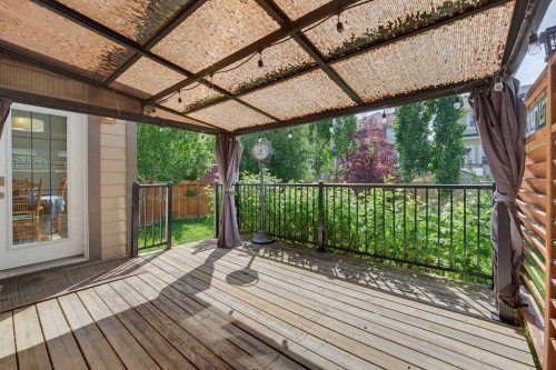 145 Sunset Manor, Cochrane, AB - Outdoor With Deck Patio Veranda With Exterior