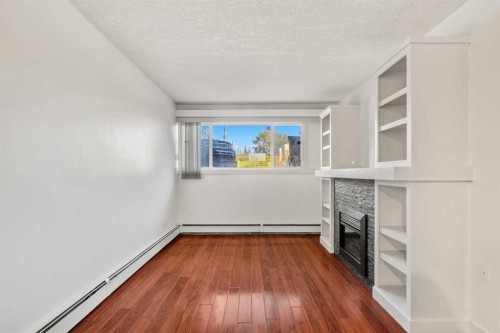 14-2906 17 Avenue Sw, Calgary, AB - Indoor Photo Showing Other Room With Fireplace