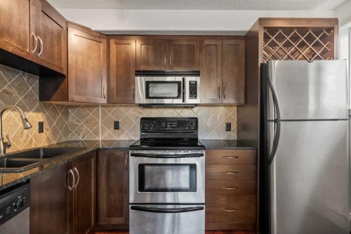 14-2906 17 Avenue Sw, Calgary, AB - Indoor Photo Showing Kitchen With Stainless Steel Kitchen With Double Sink