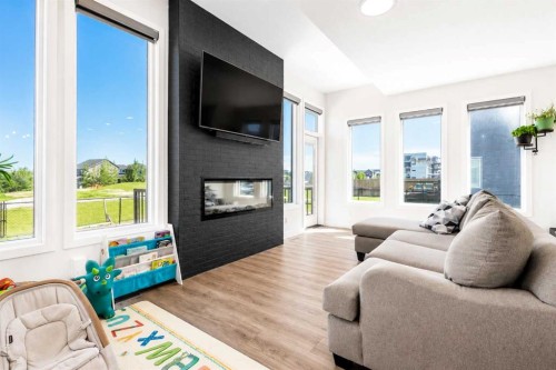267 Belmont Heath Sw, Calgary, AB - Indoor Photo Showing Living Room With Fireplace