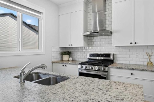 128 Setonstone Manor Se, Calgary, AB - Indoor Photo Showing Kitchen With Stainless Steel Kitchen With Double Sink With Upgraded Kitchen