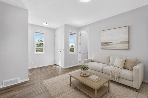 128 Setonstone Manor Se, Calgary, AB - Indoor Photo Showing Living Room