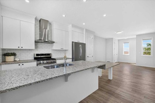 128 Setonstone Manor Se, Calgary, AB - Indoor Photo Showing Kitchen With Stainless Steel Kitchen With Double Sink With Upgraded Kitchen