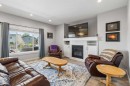7 Bishop Circle, Carstairs, AB  - Indoor Photo Showing Living Room With Fireplace 