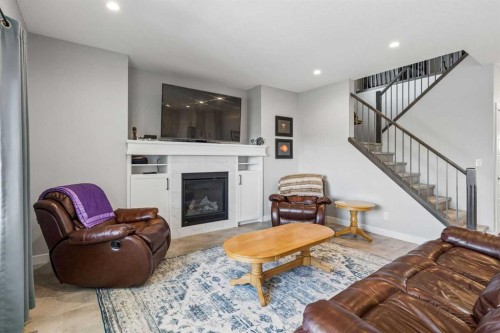 7 Bishop Circle, Carstairs, AB - Indoor Photo Showing Living Room With Fireplace