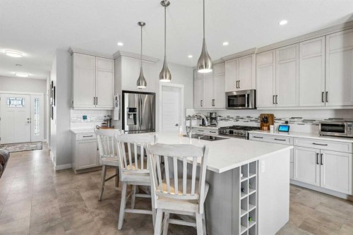 7 Bishop Circle, Carstairs, AB - Indoor Photo Showing Kitchen With Stainless Steel Kitchen With Upgraded Kitchen