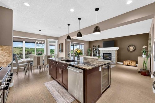 146 Valley Pointe Way Nw, Calgary, AB - Indoor Photo Showing Kitchen With Fireplace With Upgraded Kitchen