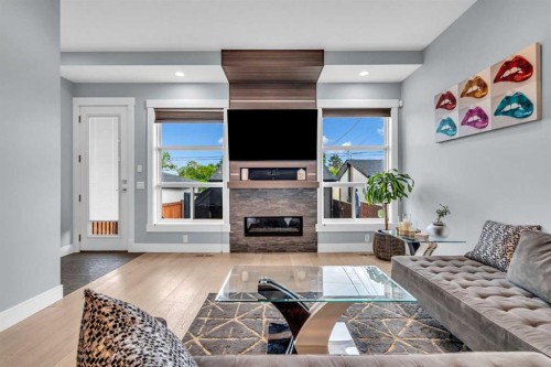 2417 25 Avenue Nw, Calgary, AB - Indoor Photo Showing Living Room With Fireplace