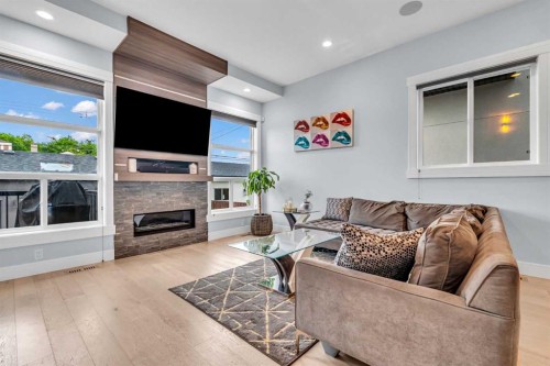 2417 25 Avenue Nw, Calgary, AB - Indoor Photo Showing Living Room With Fireplace