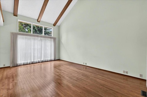 212 Stravanan Bay Sw, Calgary, AB - Indoor Photo Showing Other Room