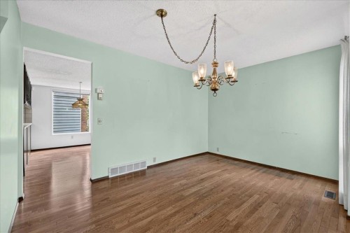212 Stravanan Bay Sw, Calgary, AB - Indoor Photo Showing Other Room