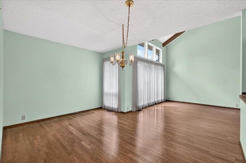 212 Stravanan Bay Sw, Calgary, AB - Indoor Photo Showing Other Room
