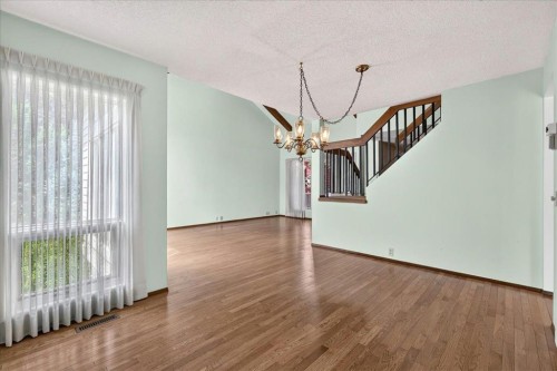 212 Stravanan Bay Sw, Calgary, AB - Indoor Photo Showing Other Room
