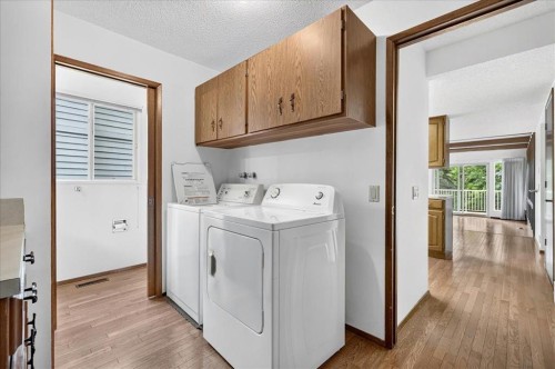 212 Stravanan Bay Sw, Calgary, AB - Indoor Photo Showing Laundry Room