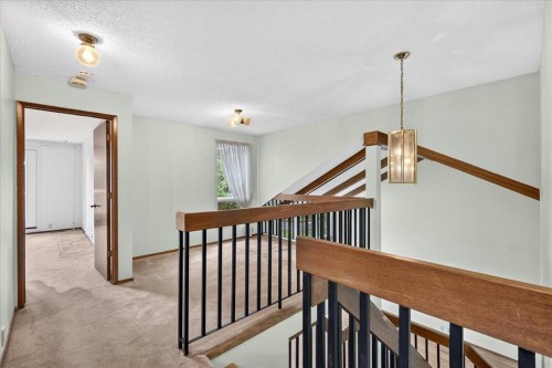 212 Stravanan Bay Sw, Calgary, AB - Indoor Photo Showing Other Room