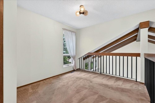 212 Stravanan Bay Sw, Calgary, AB - Indoor Photo Showing Other Room