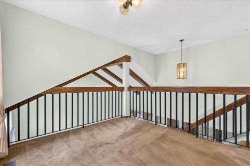 212 Stravanan Bay Sw, Calgary, AB - Indoor Photo Showing Other Room